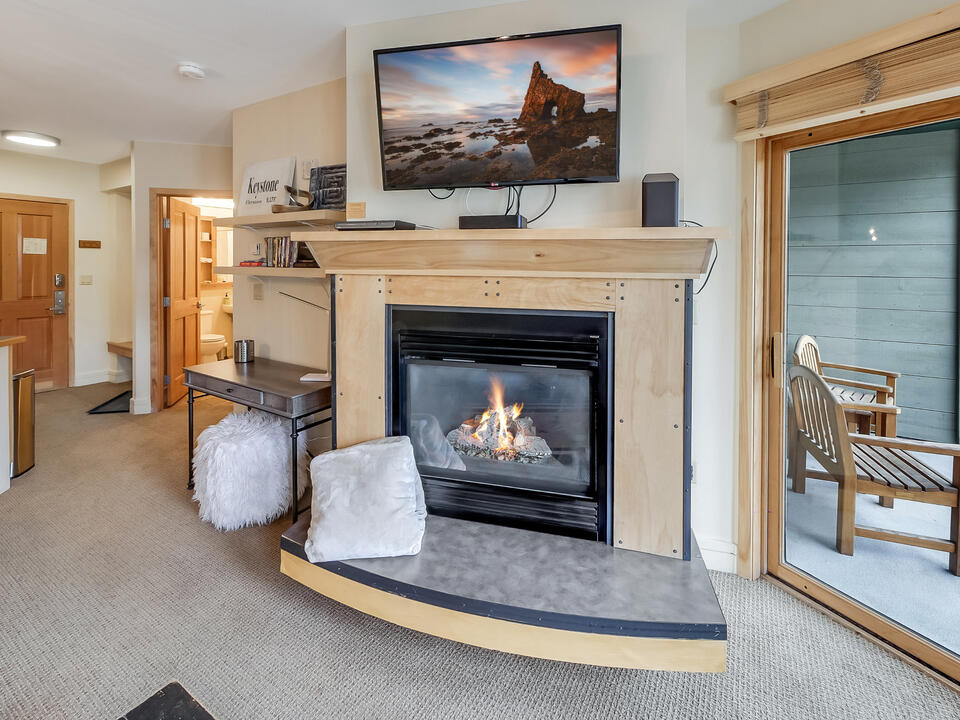 Cozy fireplace and TV